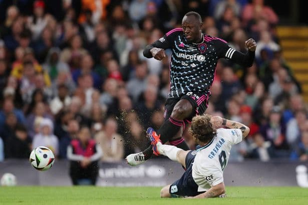 Usain Bolt signs for Manchester Sunday League football team
