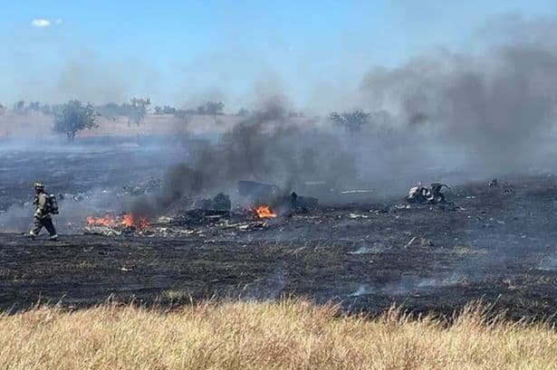 Military helicopter crash kills two and sparks wildfire - homes evacuated