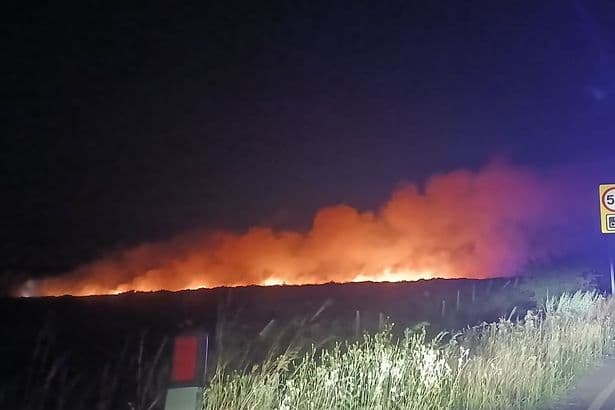 Saddleworth Moor fire live: Emergency crews battle moorland blaze as road closed
