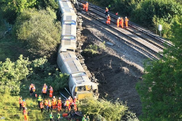 Lewes train crash horror as terrified passengers stand on top of derailed and sideways carriages
