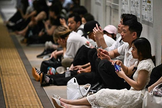 Thousands sleep in Japan airport as heavy rains block exit routes