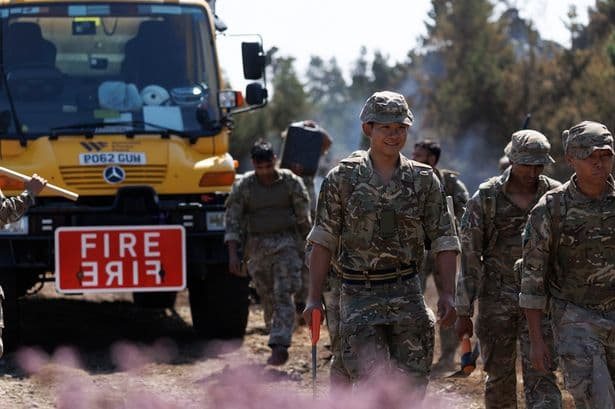 Army called in to help tackle wildfires as dozens of homes and acres of land destroyed across tinderbox Britain