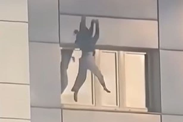 Heart-racing moment woman jumps from burning building to escape Berlin fire