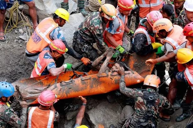Survivors pulled alive from flooded Nepal tunnel after more than a week trapped