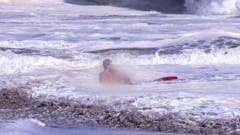 Man who captured dramatic video of lifeguard rescuing 10-year-old boy in ocean speaks to Erin Burnett