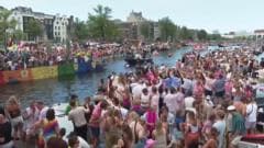 Crowds line Amsterdam's canals for Pride boat parade
