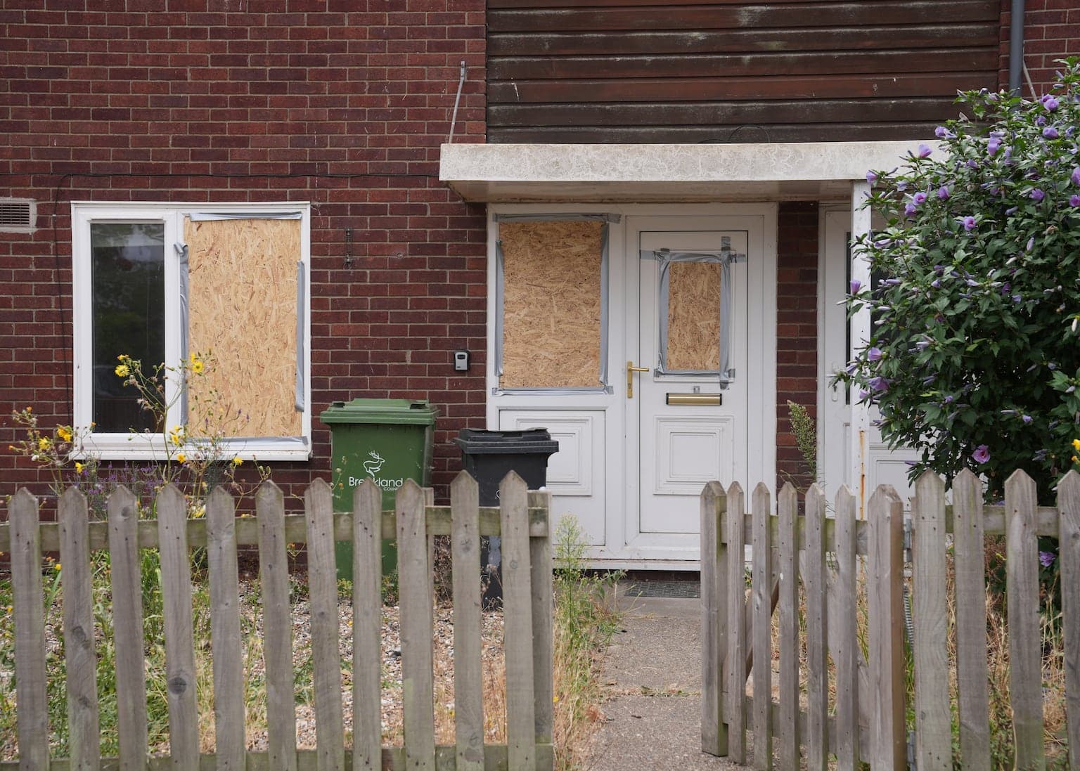 Two men arrested after police officers 'bitten and spat at' as anti-immigration protesters try to break into asylum property