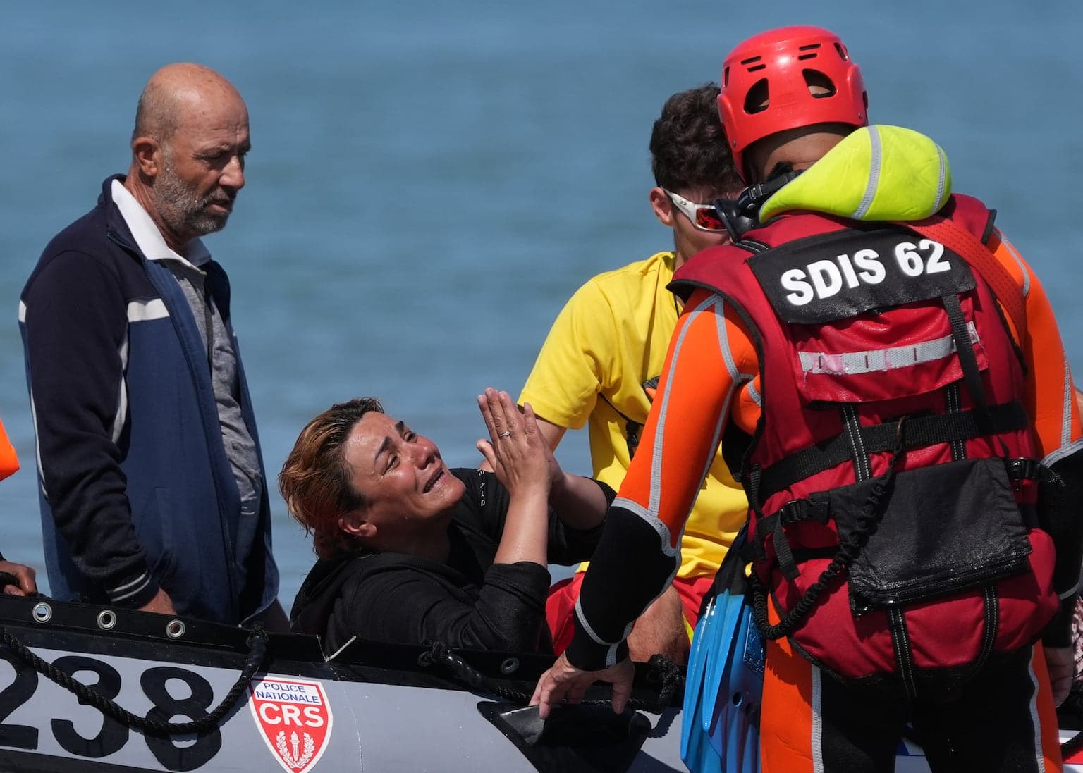 People smugglers launch 'full-frontal assault' across miles of French coast as 700 migrants attempt Channel crossing