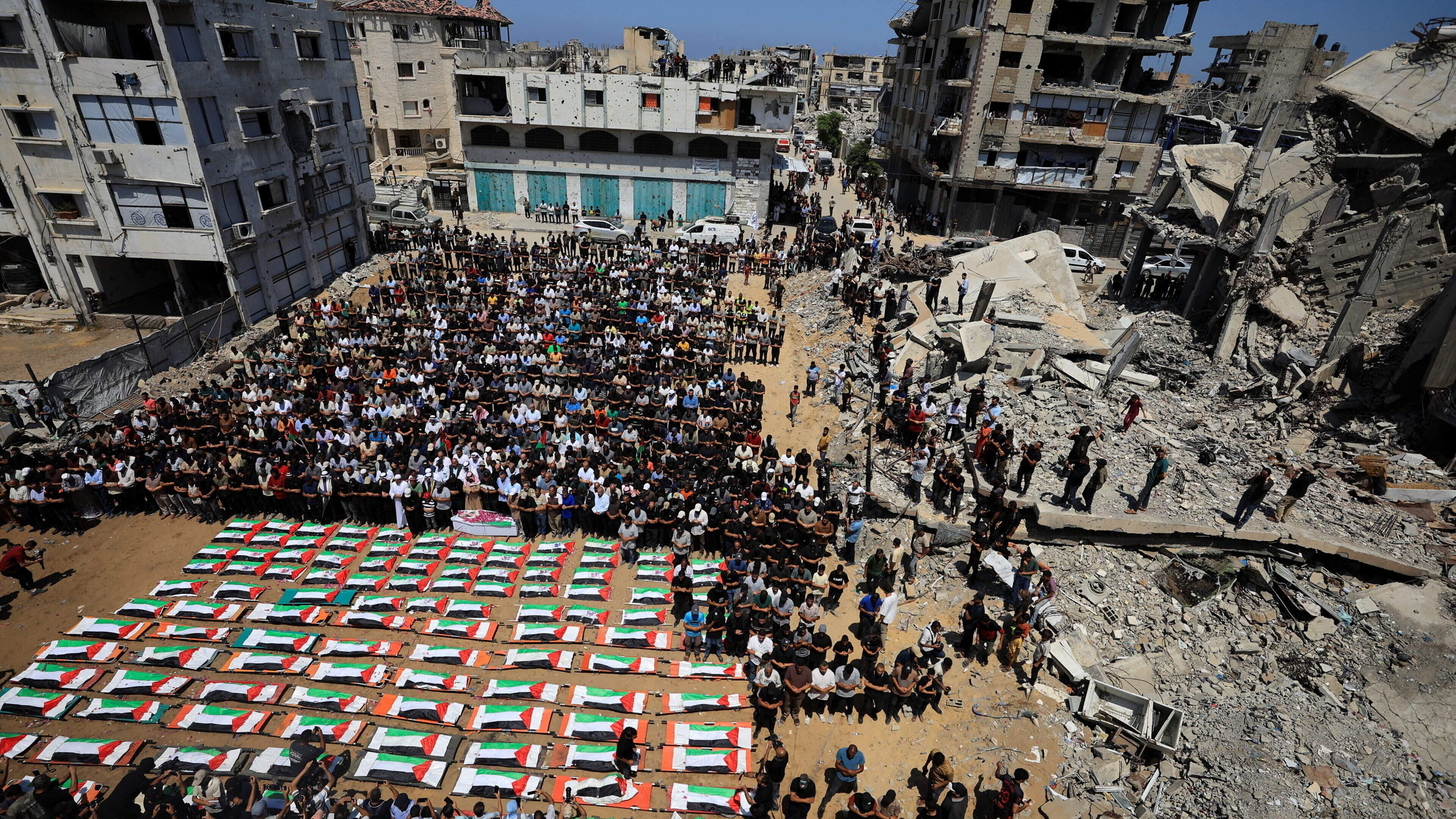 Largest mass funeral of Gaza war held as 112 bodies recovered from rubble after almost three years