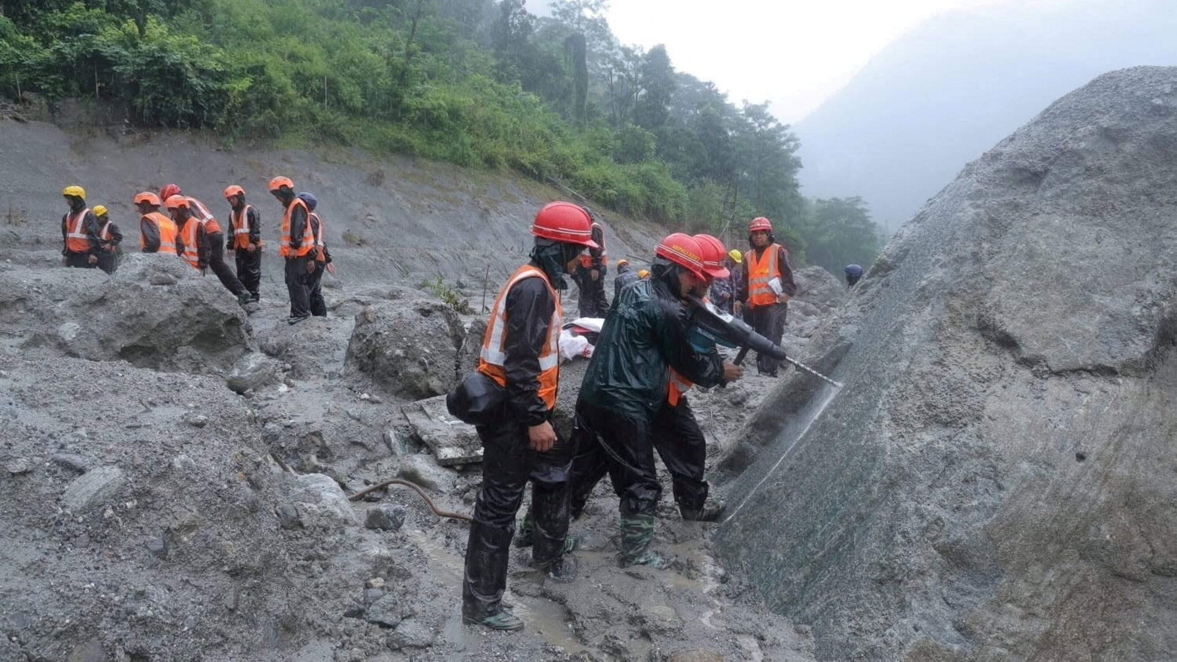 Race to save hundreds of workers trapped in tunnels after Nepal flood disaster