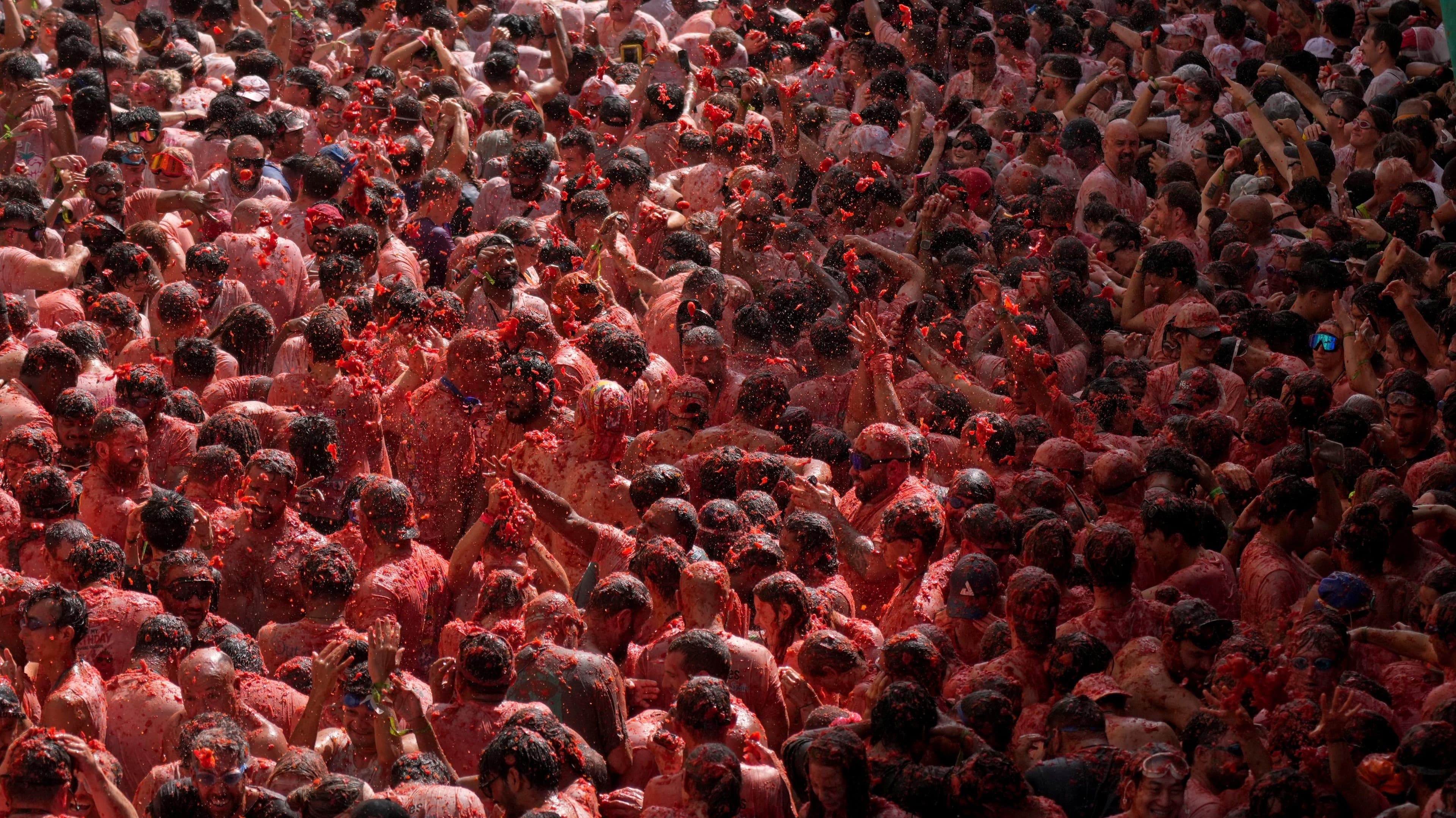 La Tomatina food fight paints small Spanish town red