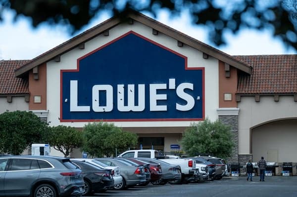 Lowe's posted higher sales but trimmed its outlook as DIY spending stayed under pressure