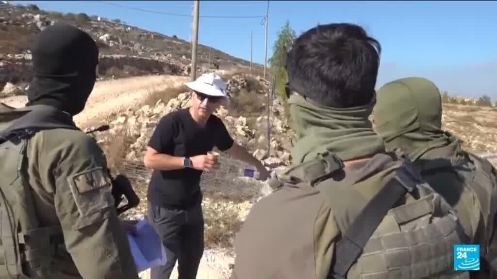 Israeli settler confronts Palestinian American at his besieged West Bank home