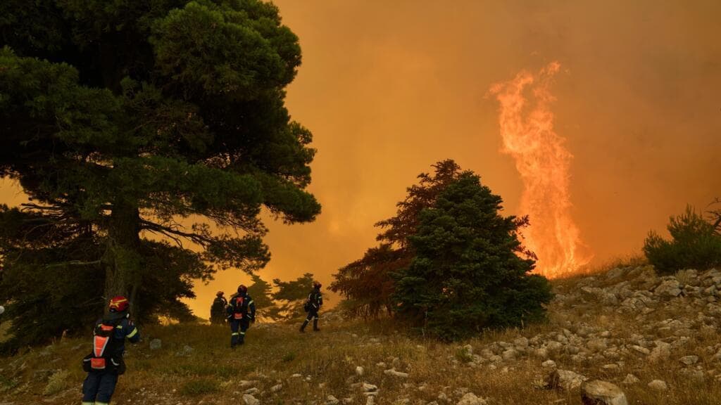 Greece's wildfires claim lives as firefighters struggle to contain flames