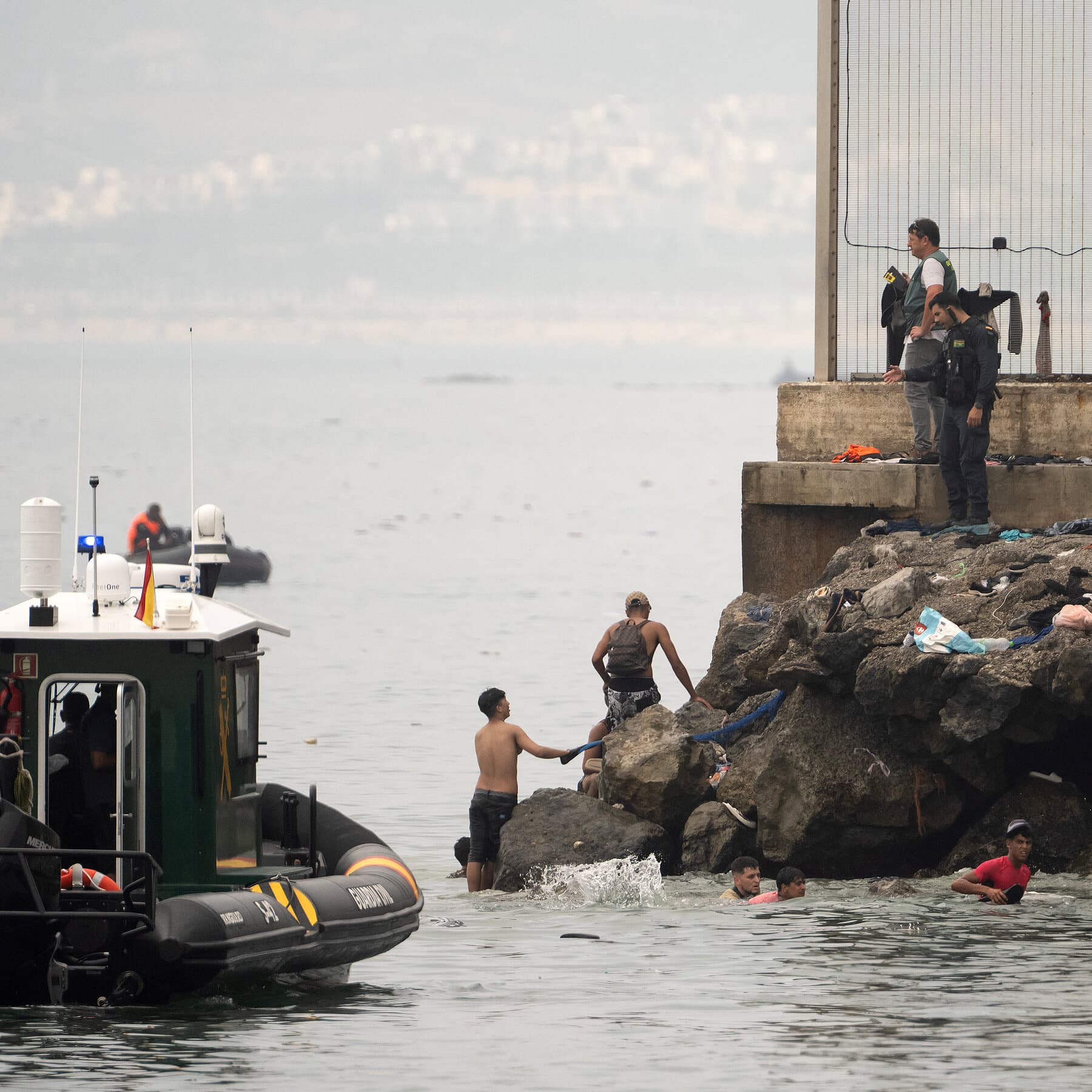 Tens of thousands of migrants voluntarily leave after crossing into Spanish territory of Ceuta