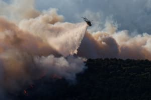 Wildfires spread across Greece, conditions worsen in France and Spain
