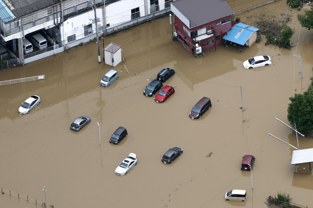 Heavy rain causes flooding near Tokyo that kills 4 and strands travellers